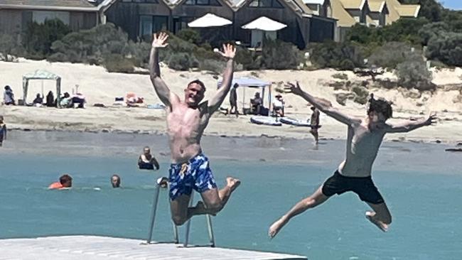 Visitors Lachlan Parker (left) and Oliver Knight (right) enjoy the Robe swimming pontoon, which is back in the water after insurance woes threatened to beach it for the first summer in 52 years. Picture: Supplied