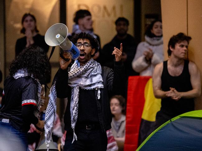 Students protesting with megaphones and banners brought tents inside the building. Picture: Jason Edwards