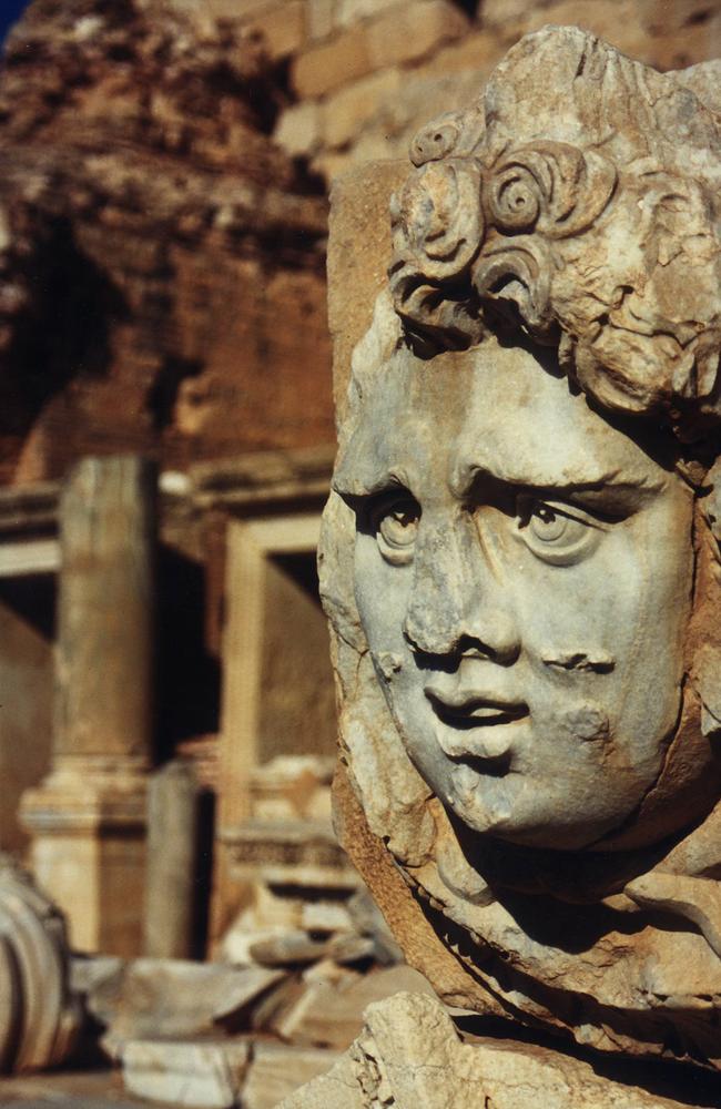 Medusa's Head statue sculpture in ruins of ancient city.