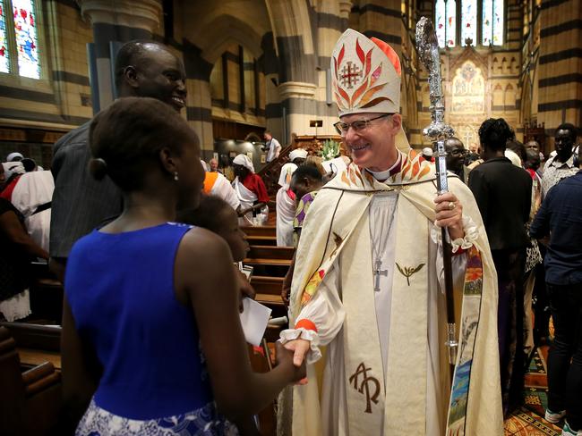 Anglican Archbishop Philip Freier leads a healing service for the African community at St Paul’s in Melbourne. Picture: Stuart McEvoy