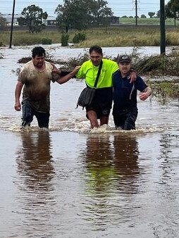 Ben Acworth (right) and a stranger helped a man who was stuck in floodwater in the swollen Westrook Creed.