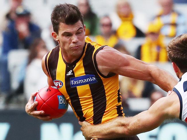 AFL Round 2. Hawthorn vs. Adelaide Crows at the MCG. Hawthorn's Jaeger O'Meara tries to power past Adelaide's Richard Douglas     . Pic: Michael Klein