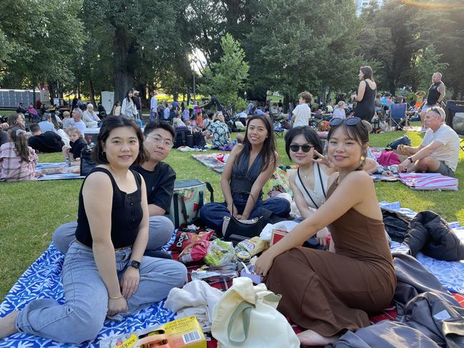 Chuang and friends at Treasury Gardens in the Melbourne CBD for the 2024 New Year's Eve fireworks. Picture: Gemma Scerri