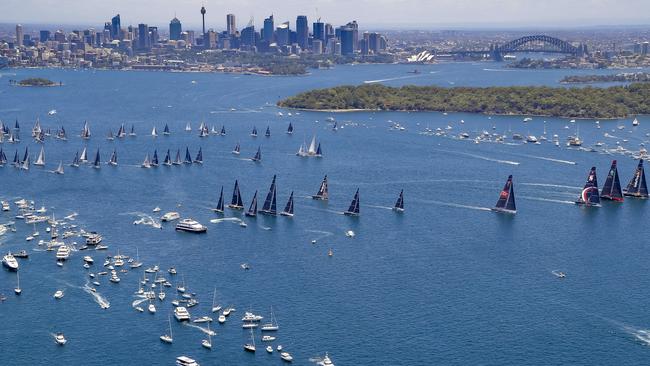 Thousands of people hit the water for the start of the race while others grab spots on vantage points around the harbour. Pic: Rolex/Studio Borlenghi