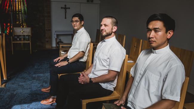 Newly ordained clergy members Minje Kim, Issac Falzon and Gerard Lai. Picture: Natalie Grono