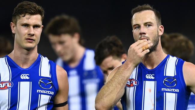 MELBOURNE, AUSTRALIA - AUGUST 14: The Kangaroos look dejected after losing the round 22 AFL match between North Melbourne Kangaroos and Sydney Swans at Marvel Stadium on August 14, 2021 in Melbourne, Australia. (Photo by Quinn Rooney/Getty Images)