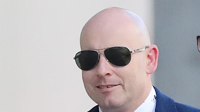 Matthew William Harding walking in the Brisbane Magistrates Court.