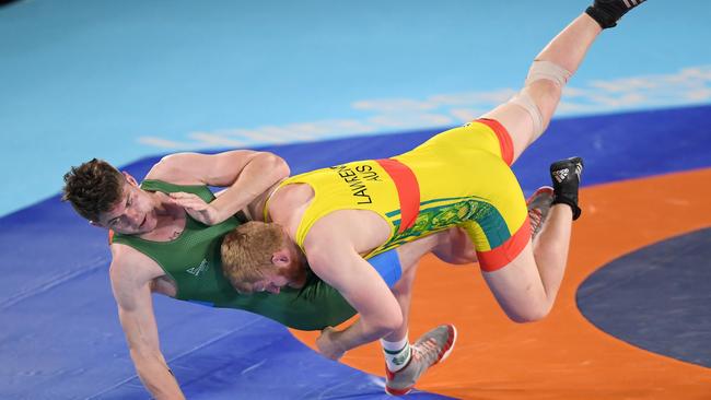 Jayden Lawrence (red) of Team Australia competes against Edward Lessing.