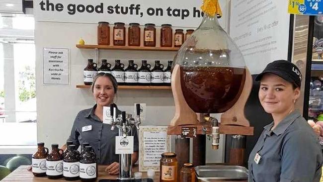 Tweed Valley IGA employees Maddie Lecke and Emma O&#39;Brien serve locally sourced Kombucha and honey which is now available on tap.