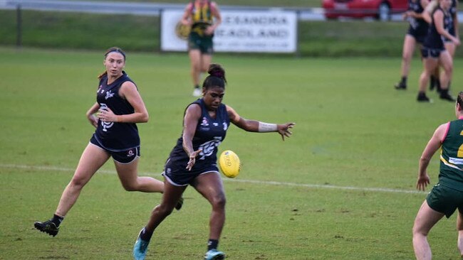 Kitara Farrar gets a kick away for Coolangatta. Pic: Jillo's Sporting Pics.