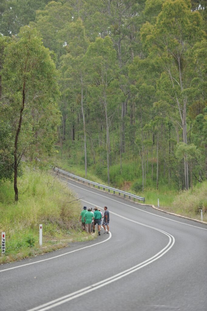 SEARCH CONTINUES: Family of the missing motorcyclist, Paul Stevenson, gather near the spot where the motorcycle was found along the Gin Gin Mount Perry road. Photo: Mike Knott / NewsMail. Picture: Mike Knott