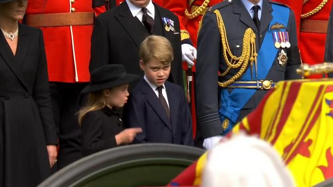 Princess Charlotte and Prince George watch as the Queen’s coffin leaves London.