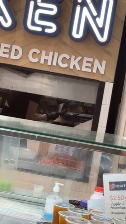 People caught styling hair in a chicken takeaway