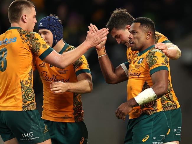 MELBOURNE, AUSTRALIA - JULY 13: Filipo Daugunu of the Wallabies celebrates with team mates after scoring a try during the International Test Match between Australia Wallabies and Wales at AAMI Park on July 13, 2024 in Melbourne, Australia. (Photo by Cameron Spencer/Getty Images)