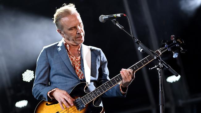 Nick Seymour of Crowded House performs during their 20th anniversary show at the Sydney Opera House.