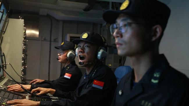 Soldiers from China’s navy conduct operations during joint combat exercises and training around the Taiwan Island on Saturday. Picture: AFP