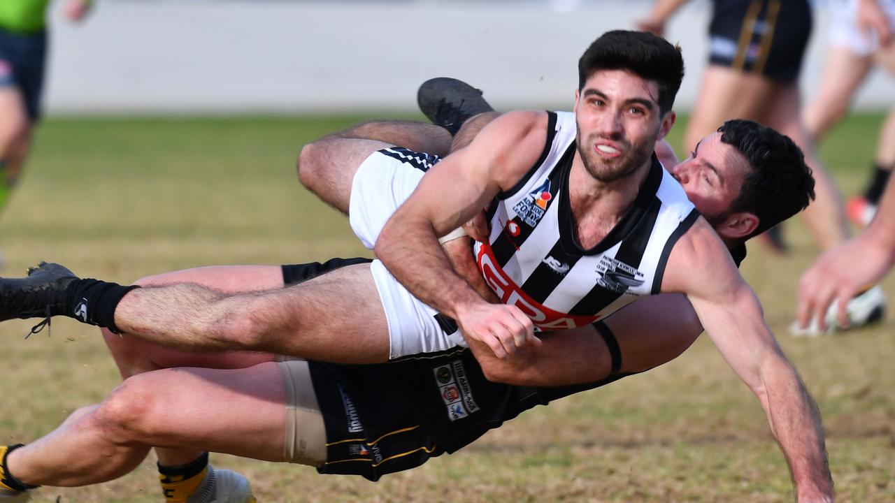 11/7/20. Adelaide Footy League Division one match between Brighton Bombers (black/gold) and Payneham Norwood Union (white/blue) at EDWARDSTOWN OVAL. (PAY) Anthony Giannini v (BB) Tarquin Brown Picture: Keryn Stevens