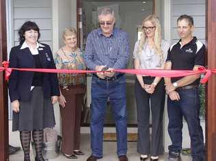 Gympie Mayor Ron Dyne (centre) cuts the ribbon to officially open Stirling Homes Queensland’s new display home at Curra as councillor Rae Gate (left) Mayoress Dulcie Dyne and Stirling Homes’ Karen and Peter Bazzan look on. Picture: David Crossley