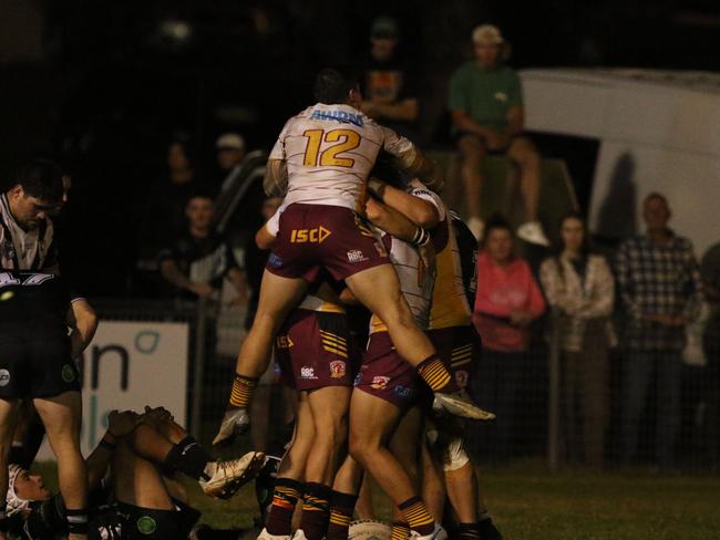 Justin Smith (No.12) crashes the Thirlmere pack. Photo: Warren Gannon Photography