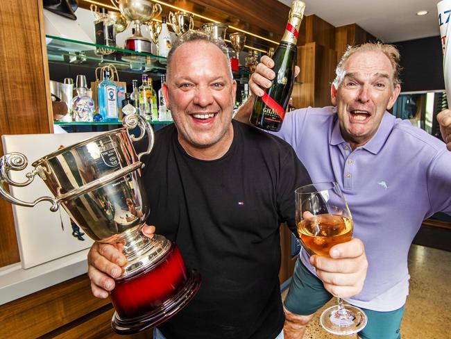 Melbourne Cup horse owner Jason Woodbridge and his friend Martin Hignett (who got Jason into horse racing) at home where he will be celebrating the Melbourne Cup on Tuesday. He is holding the 1.8m Ebor handicap cup, the biggest race in Europe which he won.Picture: NIGEL HALLETT