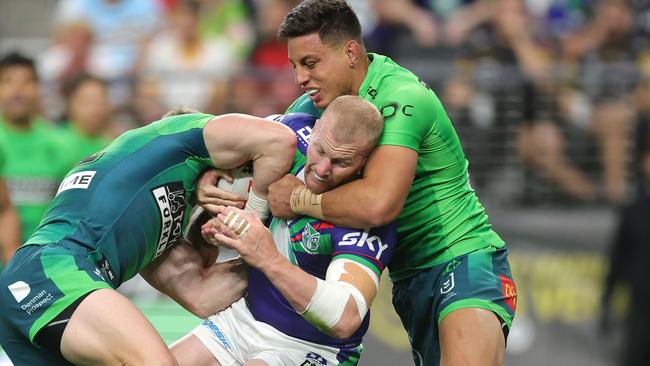 Joseph Tapine (right) faces two weeks on the sideline after a shoulder charge on Mitch Barnett. Picture: Ezra Shaw/Getty Images