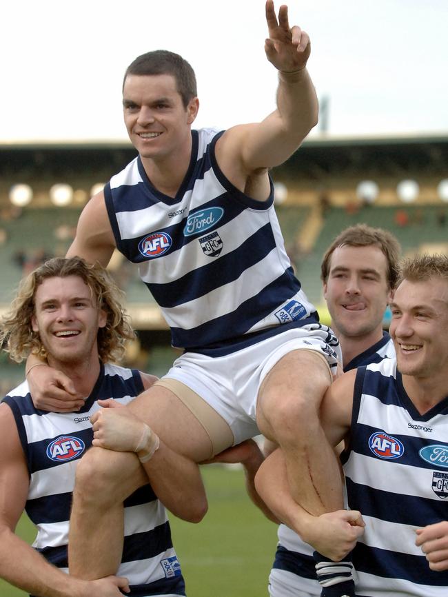 Scarlett is chaired off ground after his 150th game — a win over Fremantle in 2006.