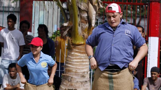 Lawrence joined in the sack race game during Indonesia's Independence Day celebration at Kerobokan Jail. Picture: Supplied