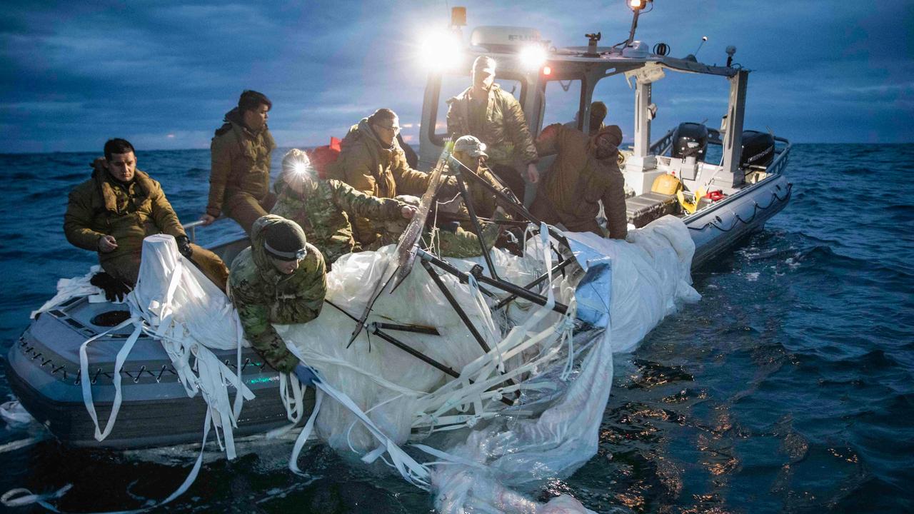 US Navy shows sailors assigned to Explosive Ordnance Disposal Group 2 recover a high-altitude surveillance balloon off the coast of Myrtle Beach, South Carolina, in the Atlantic ocean on February 5, 2023. Picture: Petty Officer 1st Class Tyler Thompson/US Navy/AFP