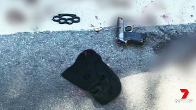 A balaclava, knuckle duster and replica pistol are pictured at the scene in Forest Lodge. Picture: Channel 7