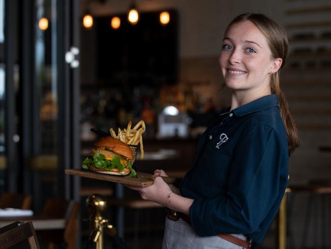 Saving Money:Casey Jackson, 18, recently graduated from high school and has taken on a few jobs to save money. She is working as a waitress and also teaching rugby and touch rugby.Working at Teddy Larkin's Seafood and Steakhouse, Harbord Diggers Club Picture by Brendan  Read.