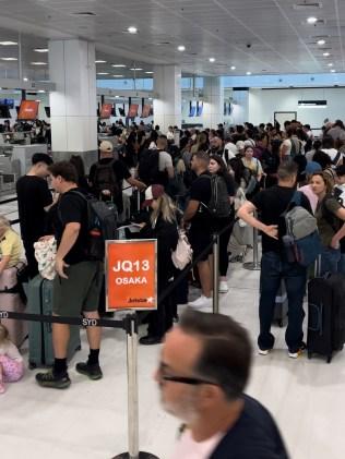 The queue for bag drop at Sydney Airport. Picture: Simone Mitchell