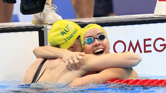 BEST 25....... Emma McKeon wins Gold in the Women's 100m Freestyle Final at the Tokyo Aquatic Centre during the Tokyo 2020 Olympics. She celebrates with Bronze medallist Cate Campbell. Pics Adam Head