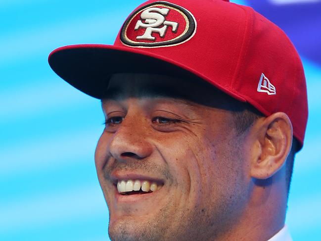 Jarryd Hayne smiles as he announces his free agent contract with the National Football League team the San Francisco 49ers at a press conference in Sydney, Tuesday, March 3, 2015. Australian rugby star Hayne has agreed to a contract with the San Francisco 49ers, a person with knowledge of the deal said Tuesday. (AP Photo/Rick Rycroft)