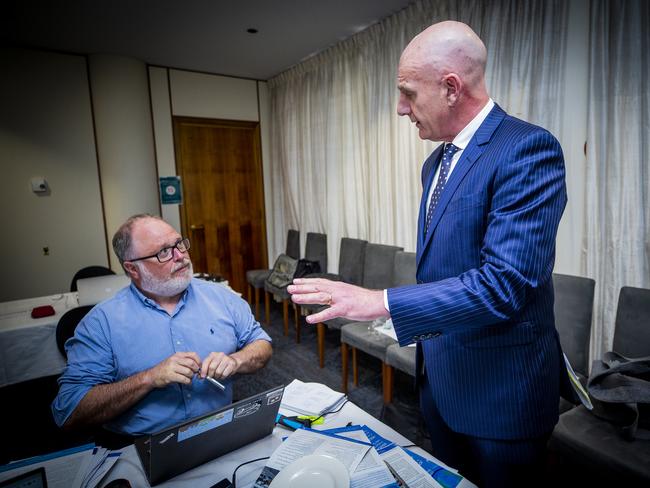 Before delivering his speech to parliament, Premier Peter Gutwein talks to Mercury political editor David Killick during the budget lockup. Picture: Richard Jupe