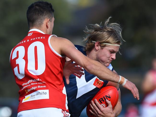 EDFL footy: Avondale Heights v Glenroy. (L-R) Glenroy's Daniel Riley (30) and Avondale Heights' Hamish Murphy (38). Picture: Josie Hayden