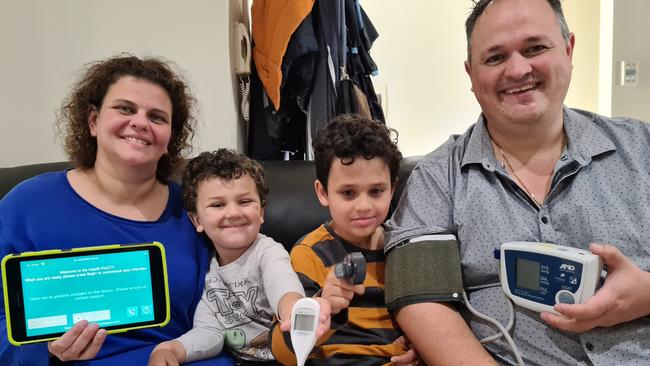 Simone and Angelo Katsilis, with their sons Dimitri, 4, and Stavros, 8, with some of the equipment. Picture: Elizabeth Henson