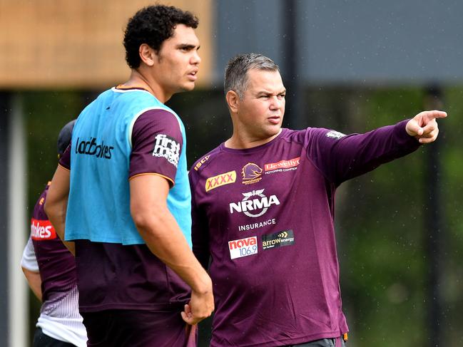 Xavier Coates (left) and Broncos coach Anthony Seibold (right) are seen during Brisbane Broncos training at Clive Berghofer Field in Brisbane, Thursday, June 27, 2019. The Broncos are playing the Knights in their round 15 NRL clash in Newcastle on Saturday. (AAP Image/Darren England) NO ARCHIVING