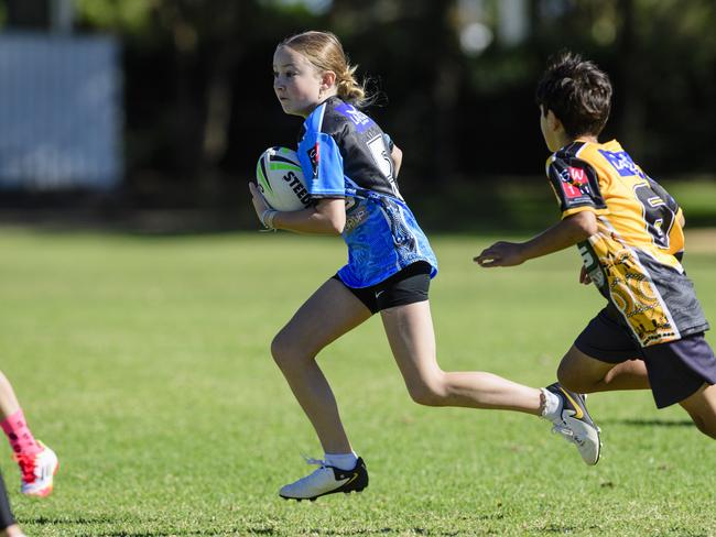 Ruby Burr makes ground for Middle Ridge State School in the inaugural Primary Interschools Reconciliation Touch Carnival hosted by Glenvale State School, Wednesday, May 28, 2025. Picture: Kevin Farmer