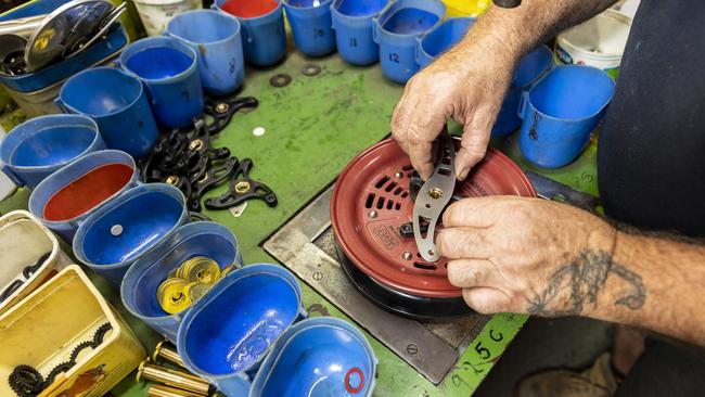 Alvey Reels were acquired by Gowings in 2022, which owns surfing brand FCS. Alvey Reels are assembled by hand in their workshop at Carole Park. Picture: Matthew Poon