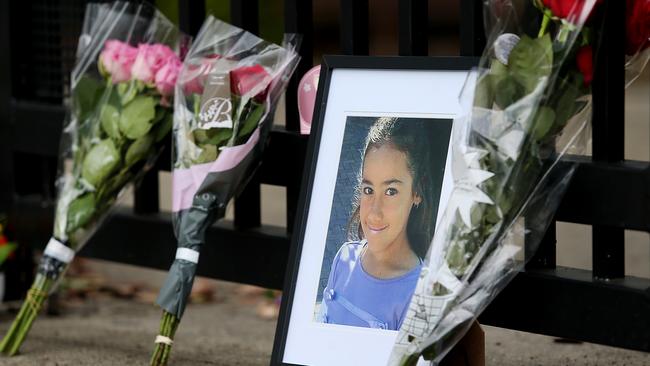 Flowers and messages outside Marsden State School to schoolgirl Tiahleigh Palmer who was found dead in the Pimpama River. Pictures: Jack Tran