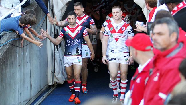 Now retired skipper Anthony Minichiello leads out his Roosters for the Anzac Day clash last year.