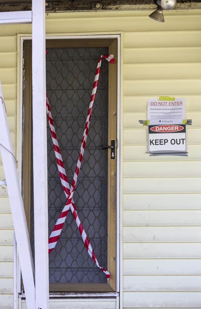 An abandoned, flood-damaged house in Rocklea. More than 100 houses have been bought back and demolished, with many other raised. Picture : Matthew Poon.