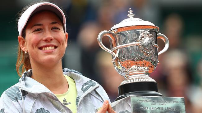 Garbine Muguruza poses with the French Open trophy following her victory over Serena Williams.