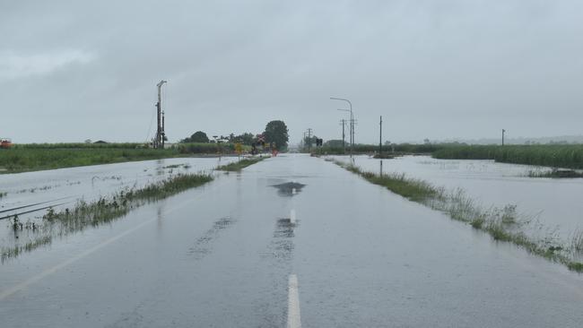 Flooded roads and cane fields alone Walkerston – Homebush Road in Mackay, Queensland. Photo: Zoe Devenport