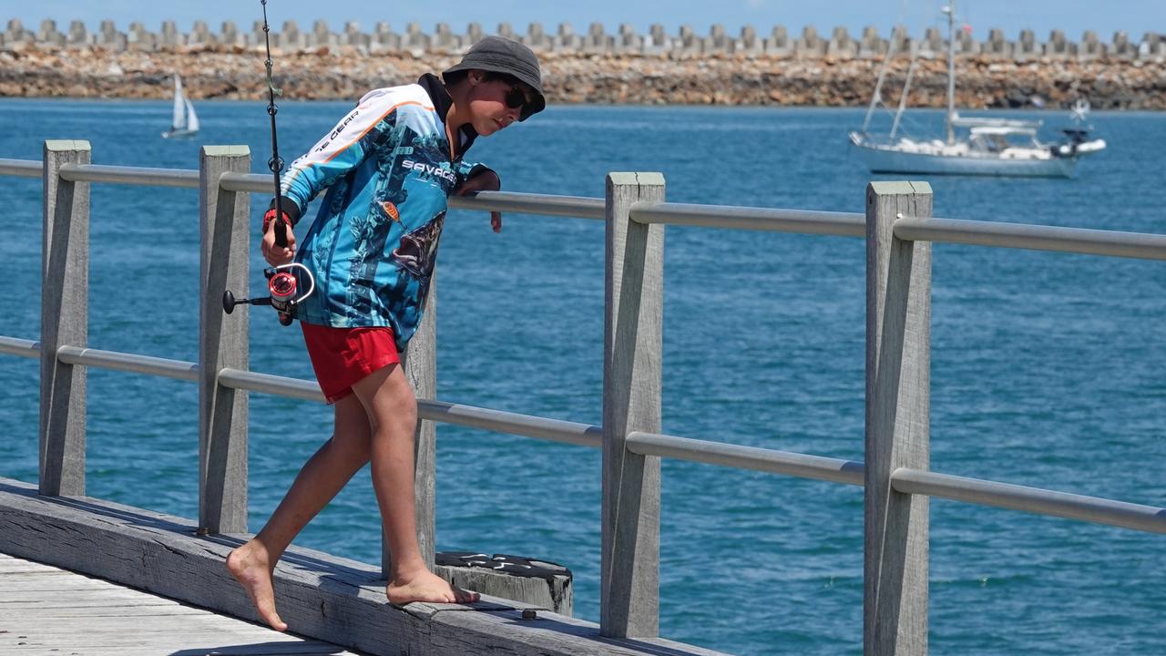 Here fishy, fishy, fishy. A young lad scouts for Spot X. Picture: Chris Knight