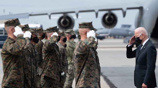 US President Joe Biden salutes members of the military transfer team after attending a dignified transfer of the 13 members of the US military killed in Afghanistan this month. Picture: AFP