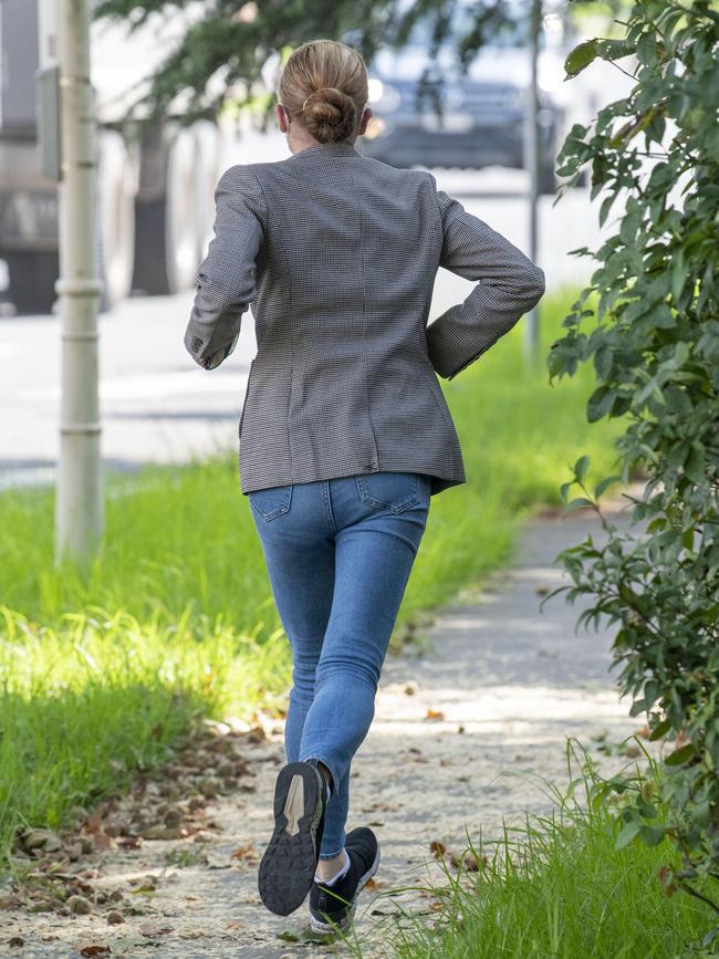 Samantha Azzopardi ran from the media before changing her outfit to enter court. Picture: Simon Bullard