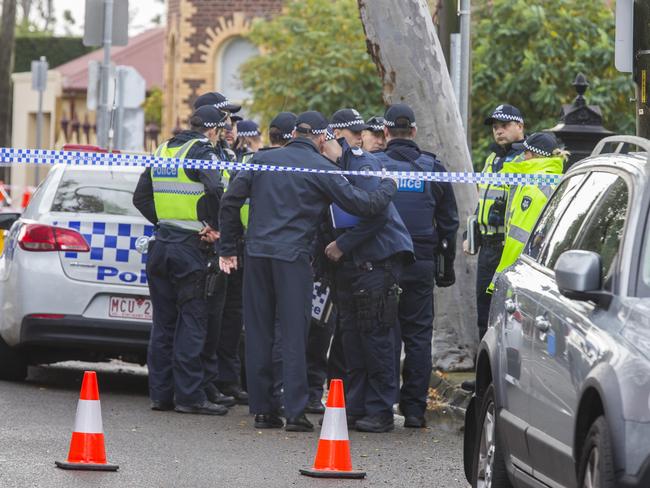 Police investigators at Bay Street in Brighton. Picture: Valeriu Campan