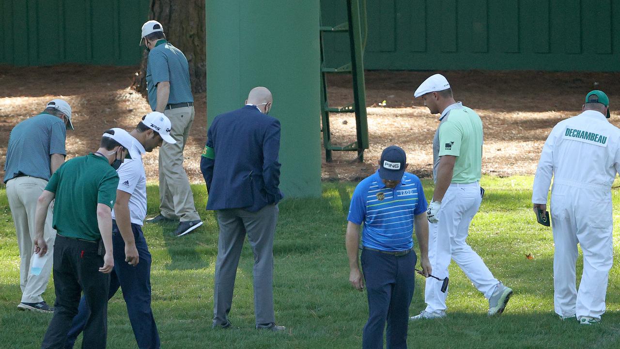 Bryson DeChambeau searches for his ball. (Photo by Patrick Smith/Getty Images)