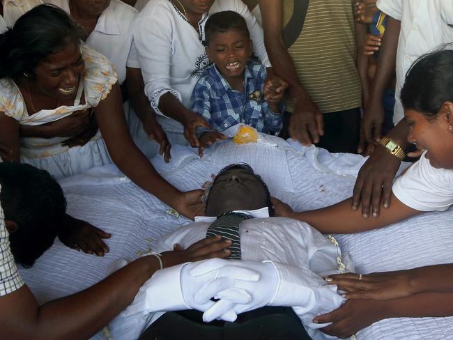 The disease is similar to a condition found in India, Egypt and Central America. Pictured, family mourns the body of Seneviratnalage Jayatillak. Picture: AP Photo/Eranga Jayawardena.